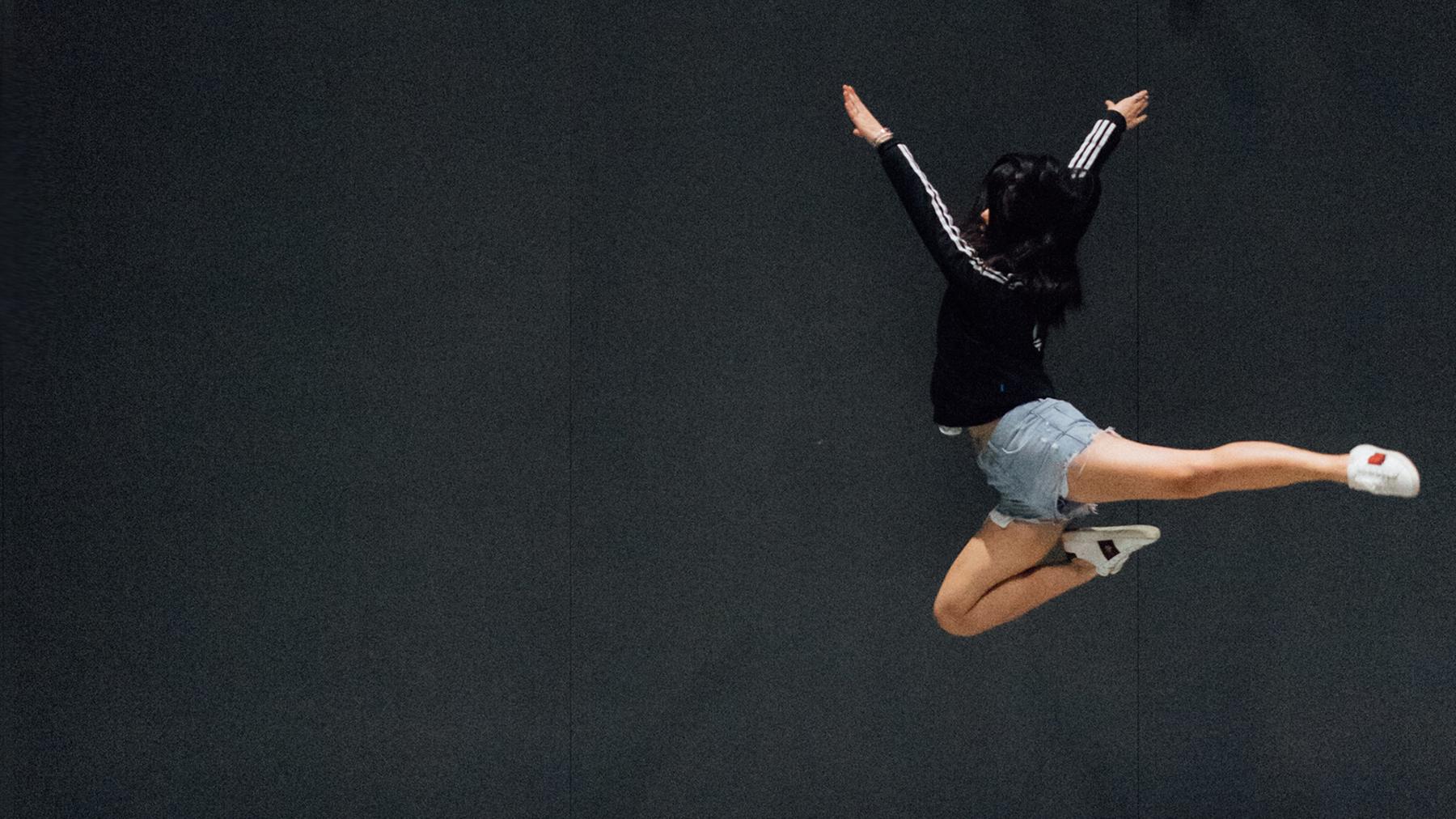 A dancer mid-leap